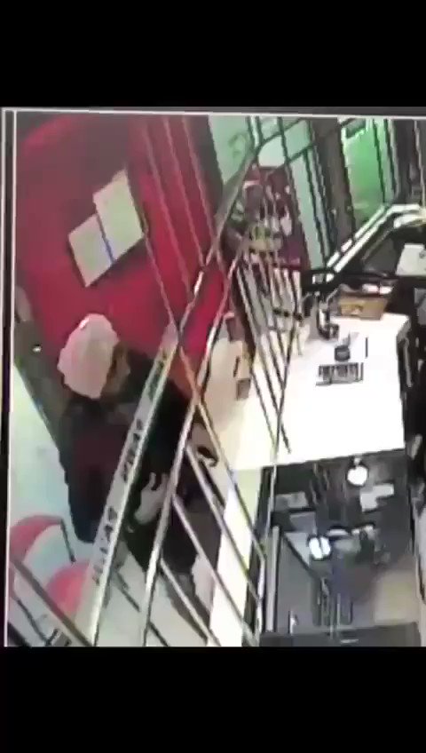 VIDEO: Police have released CCTV footage of the suspect who threatened to blow up a pawn shop outside Boon Lay MRT station. He's about 1.75m tall, and last seen wearing a pink turban, blue jacket and long brown pants (Singapore Police Force)    