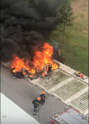 Jaguar catches fire in open carpark in Bukit Panjang, no one injured    