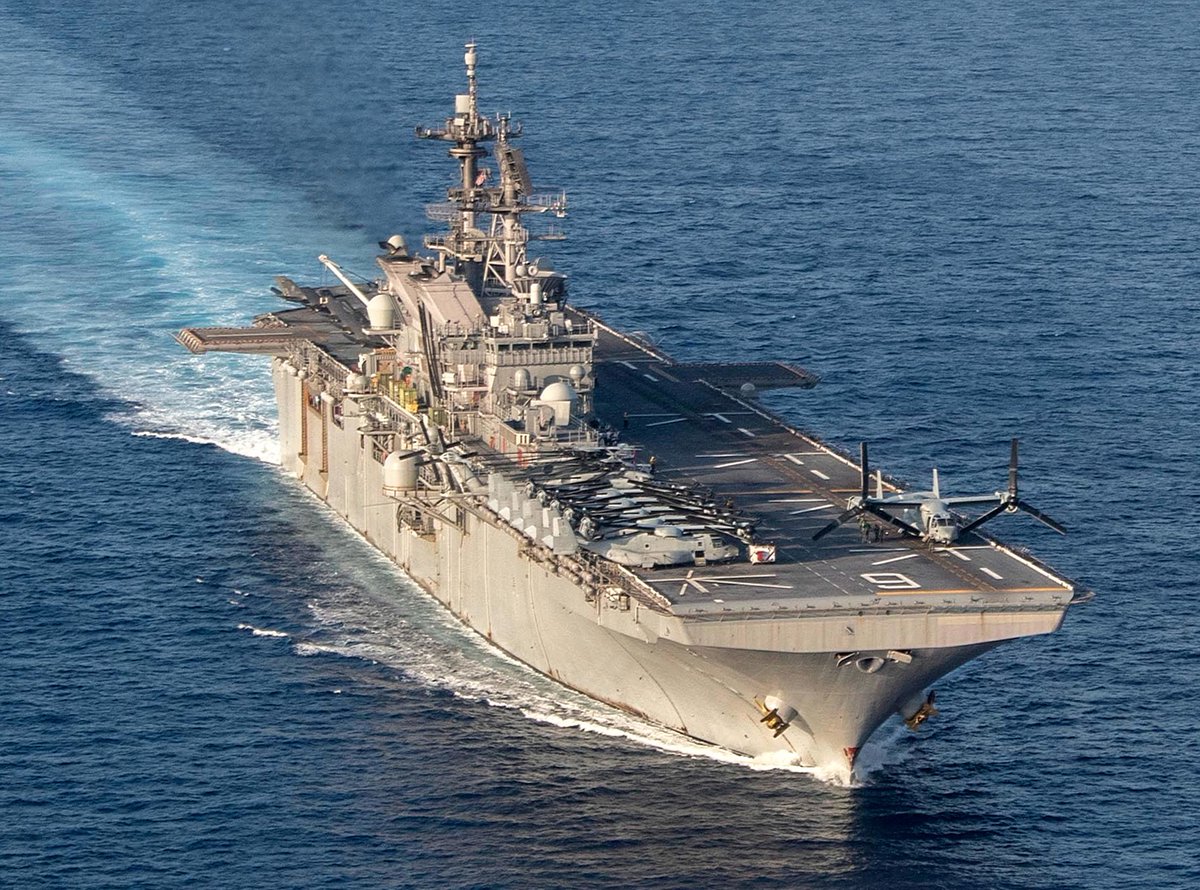 Assault ship USS AMERICA LHA6 cruising the South China Sea 18 April. USMC Marine Corps MV-22B Osprey tilt-rotor aircraft and CH-53E helicopters are ranged forward, with F-35B Joint Strike Fighters aft
