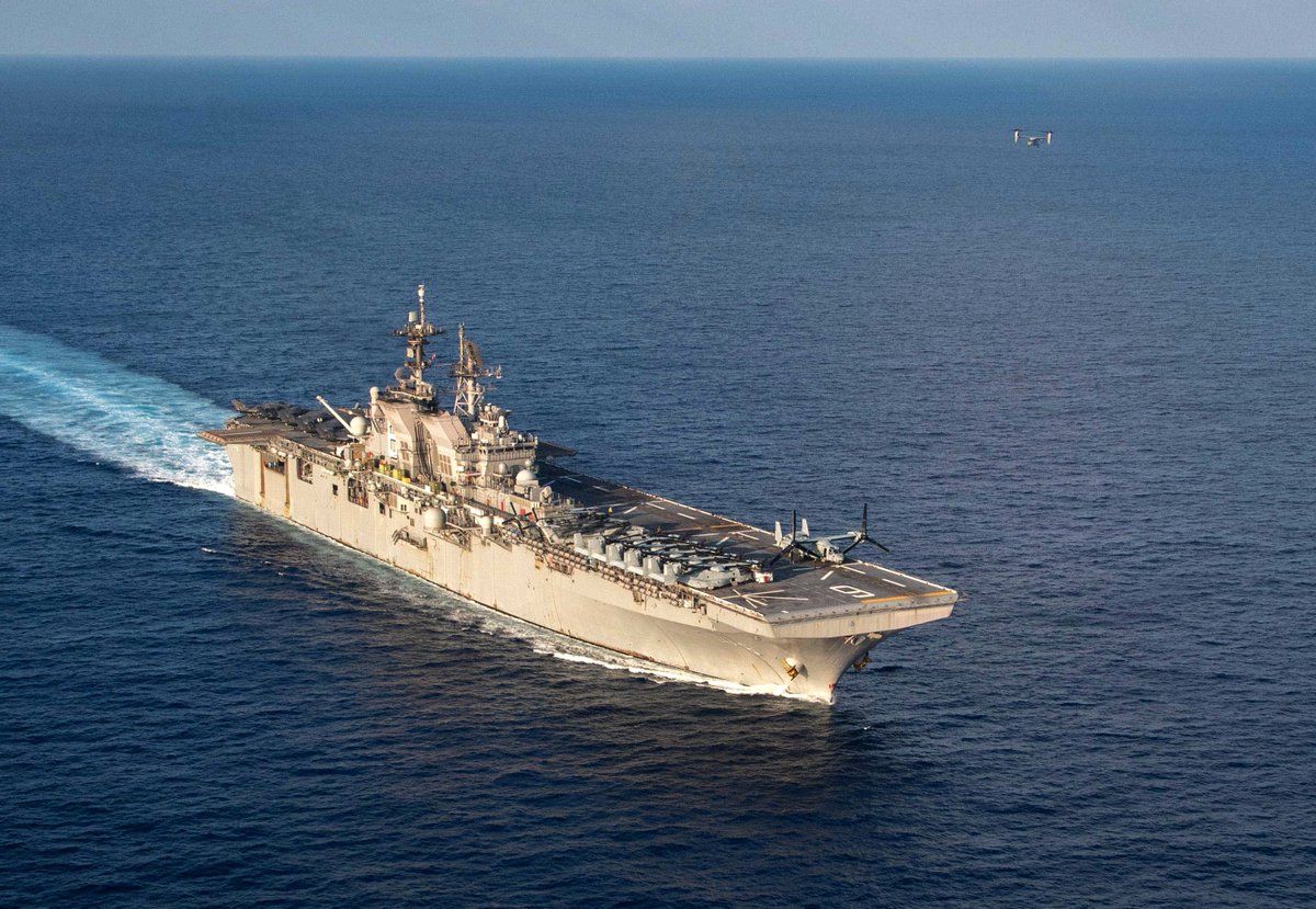 Assault ship USS AMERICA LHA6 cruising the South China Sea 18 April. USMC Marine Corps MV-22B Osprey tilt-rotor aircraft and CH-53E helicopters are ranged forward, with F-35B Joint Strike Fighters aft