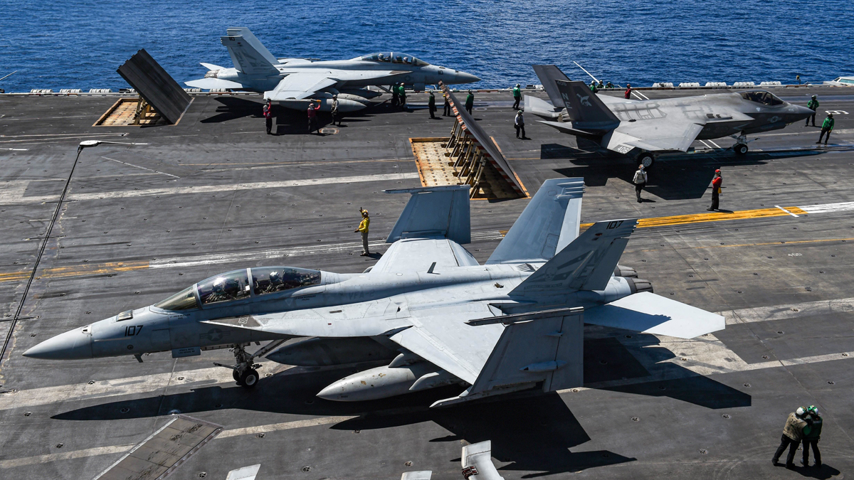 USNavy Sailors manage the flight deck aboard aircraft carrier USSCarlVinson during operations this week in the South China Sea