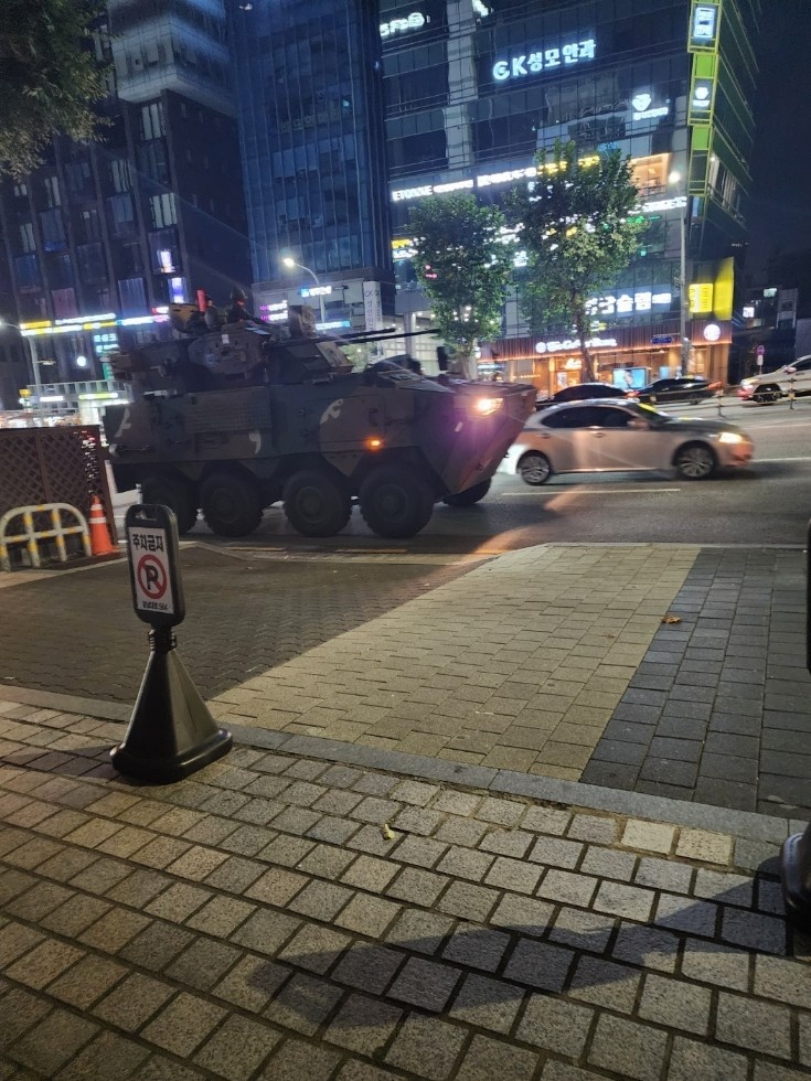 An armored car which belongs to Capital Defense Command of South Korea is seen dispatched near Sadang Station, southern Seoul on Tuesday night