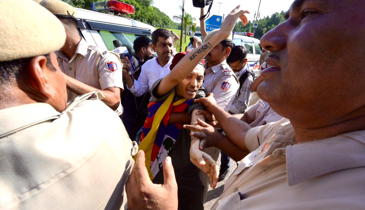 Delhi Police detain members of the Tibetan Youth Congress during a protest against the visit of Chinese Foreign Minister Wang Yi, near the Chinese Embassy in New Delhi