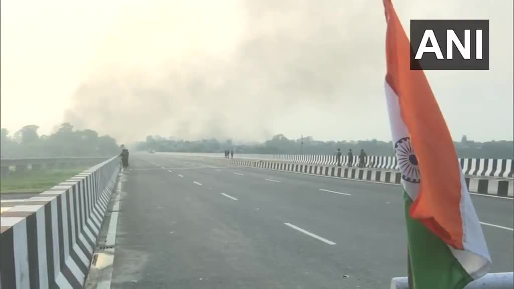 Thick smoke rises from the Nepali town of Kakadbhitta amid violent protests in the country, as seen from India's Panitanki. The Miteri bridge connecting India's Panitanki and Nepal's Kakadbhitta is being secured by SSB personnel on the India side